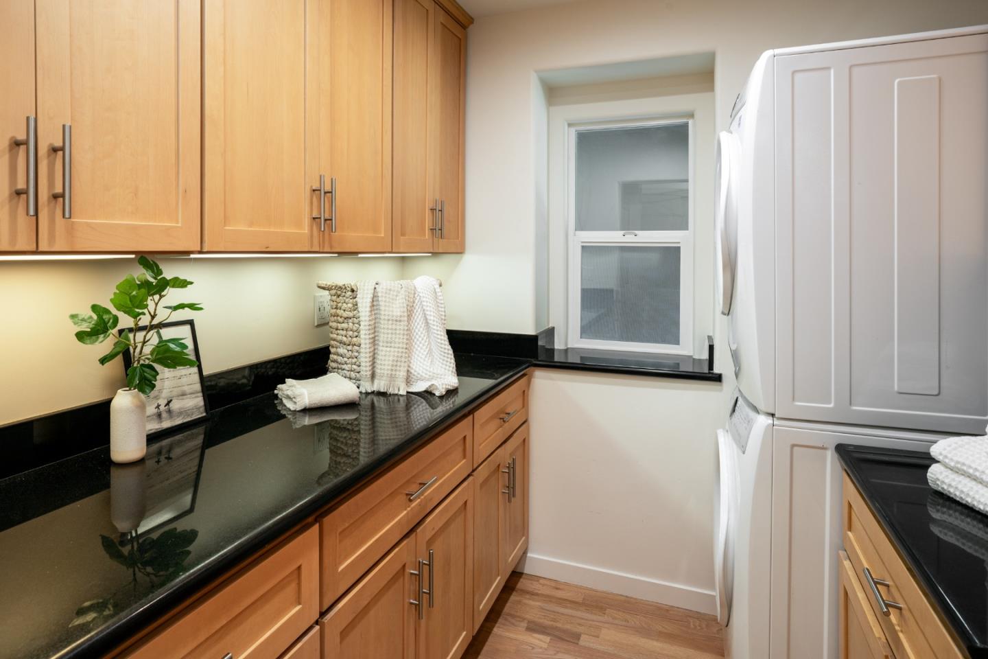 6932 Freedom Boulevard Aptos, CA 95003 - Photo 20 of 49 a kitchen with stainless steel appliances granite countertop a sink a stove and white cabinets