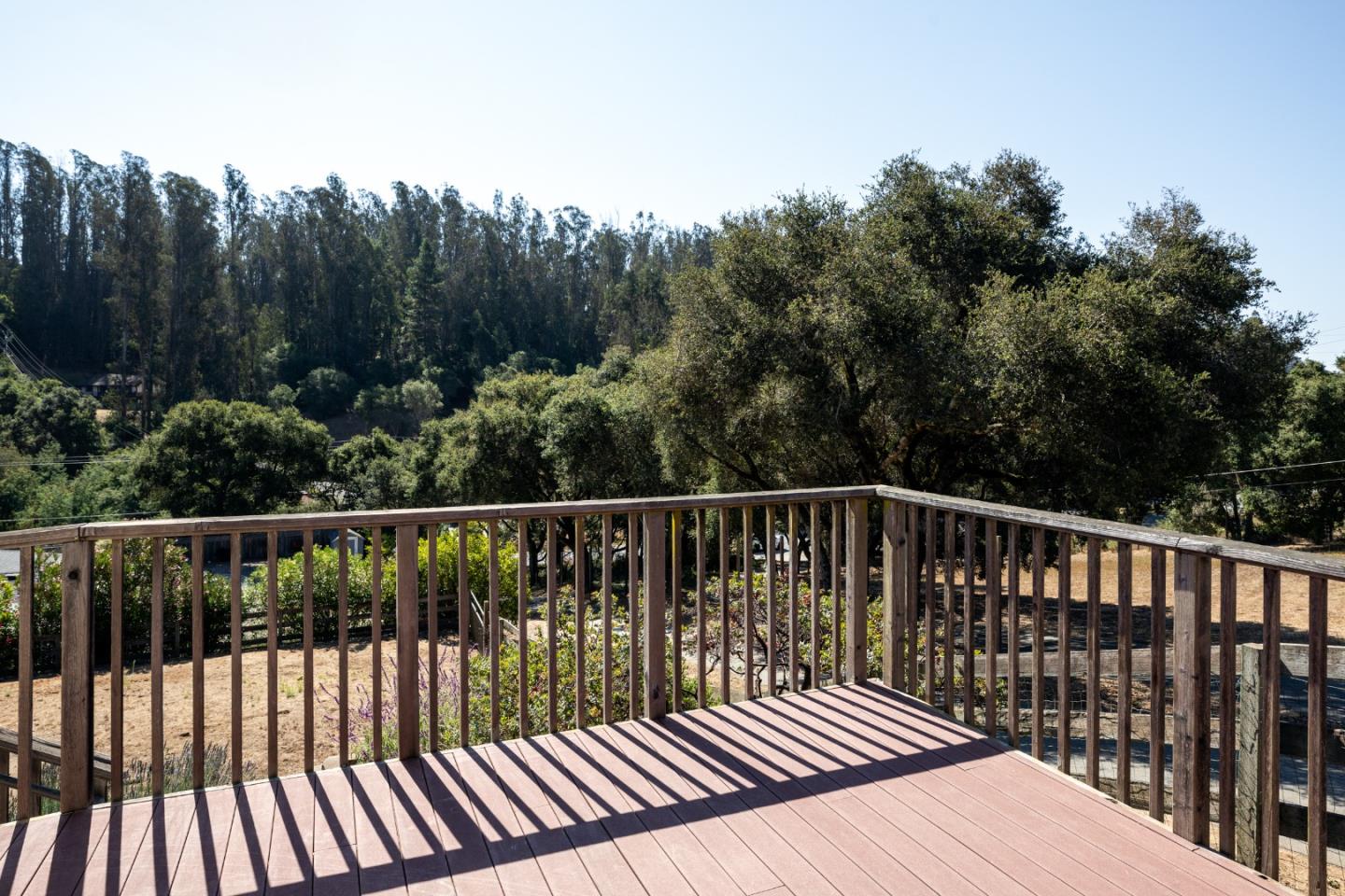 6932 Freedom Boulevard Aptos, CA 95003 - Photo 34 of 49 a balcony with wooden floor and fence