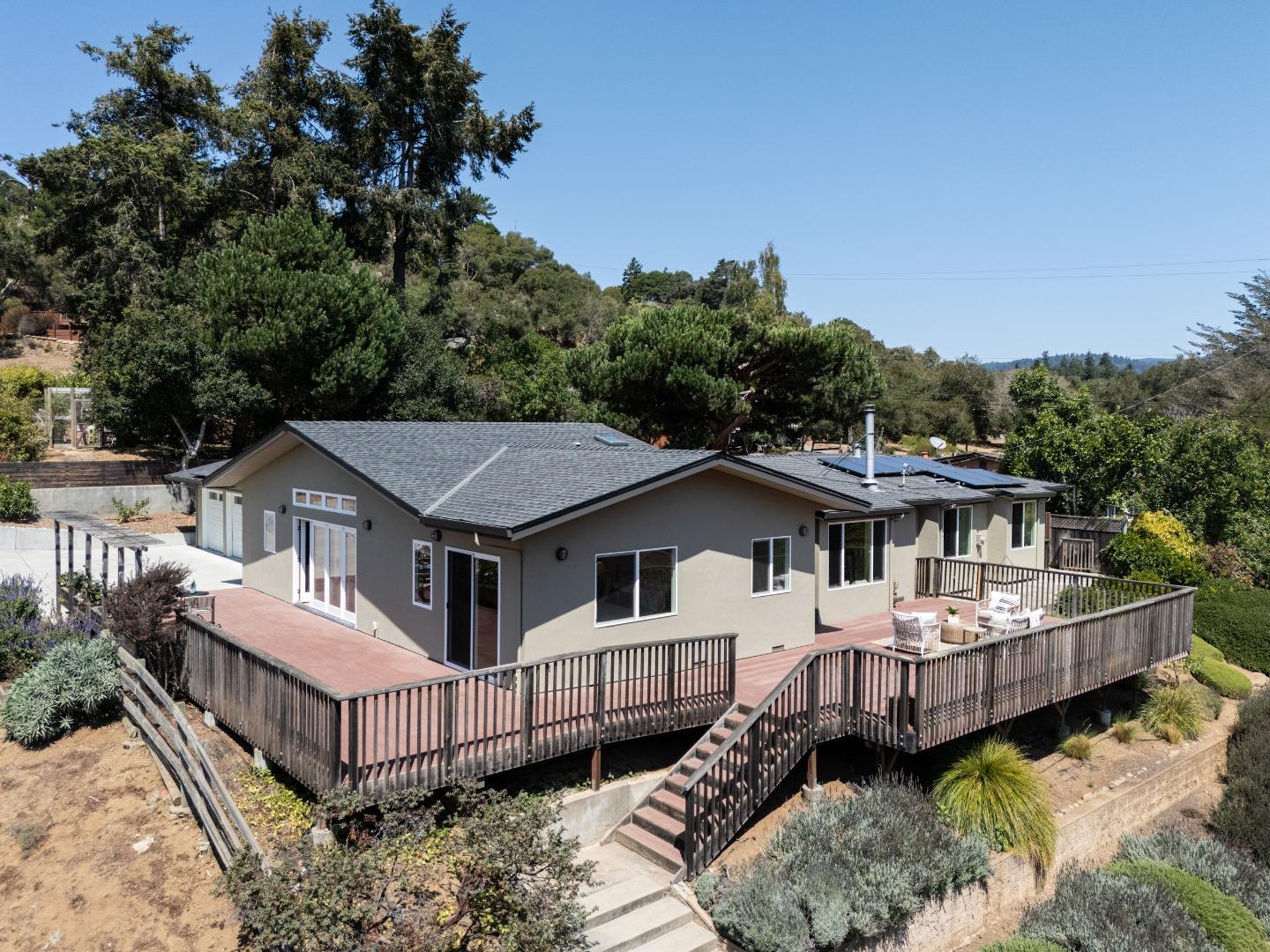 6932 Freedom Boulevard Aptos, CA 95003 - Photo 42 of 49 a view of a house with a wooden deck and a forest