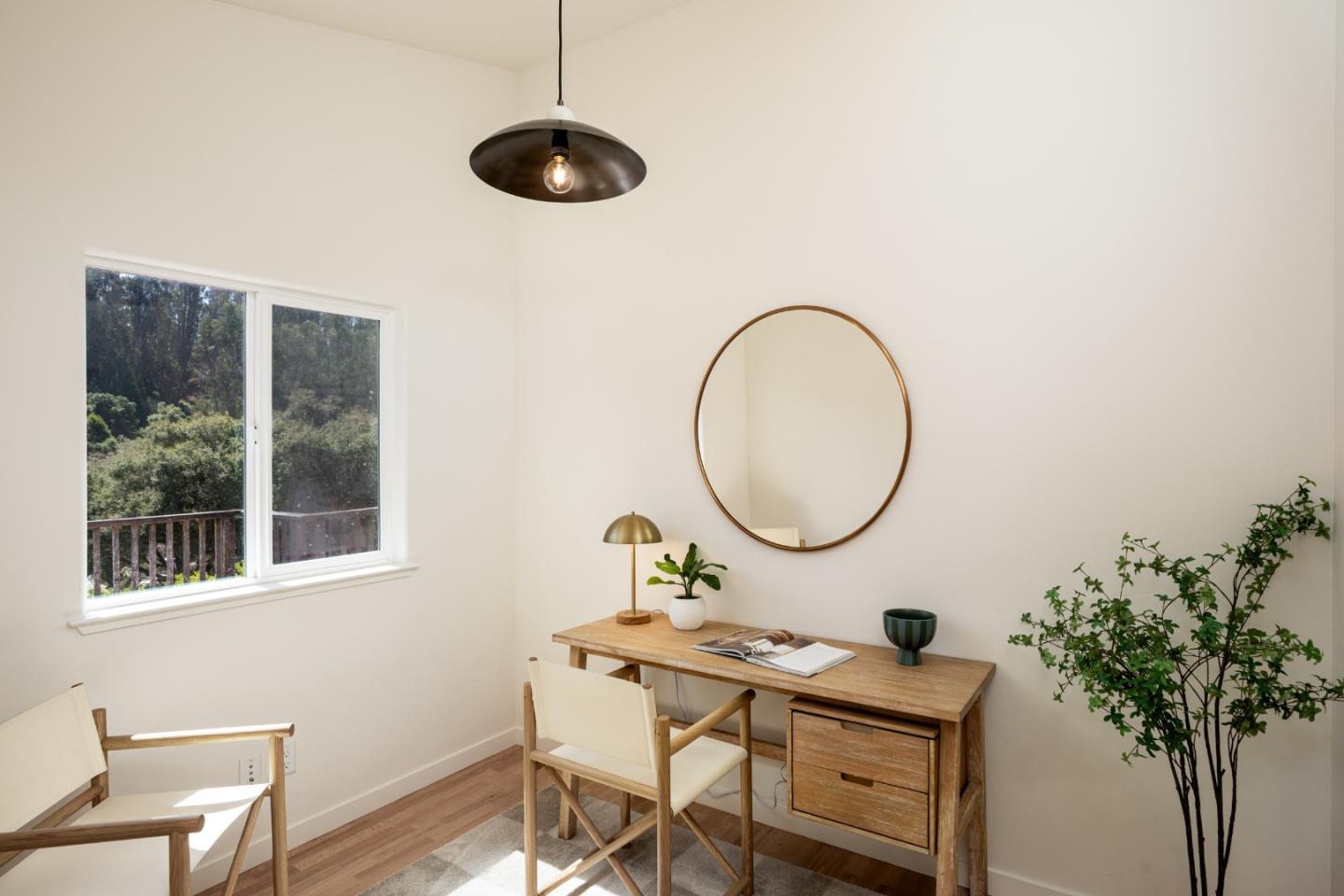 6932 Freedom Boulevard Aptos, CA 95003 - Photo 9 of 49 a view of a workspace room with furniture and a potted plant