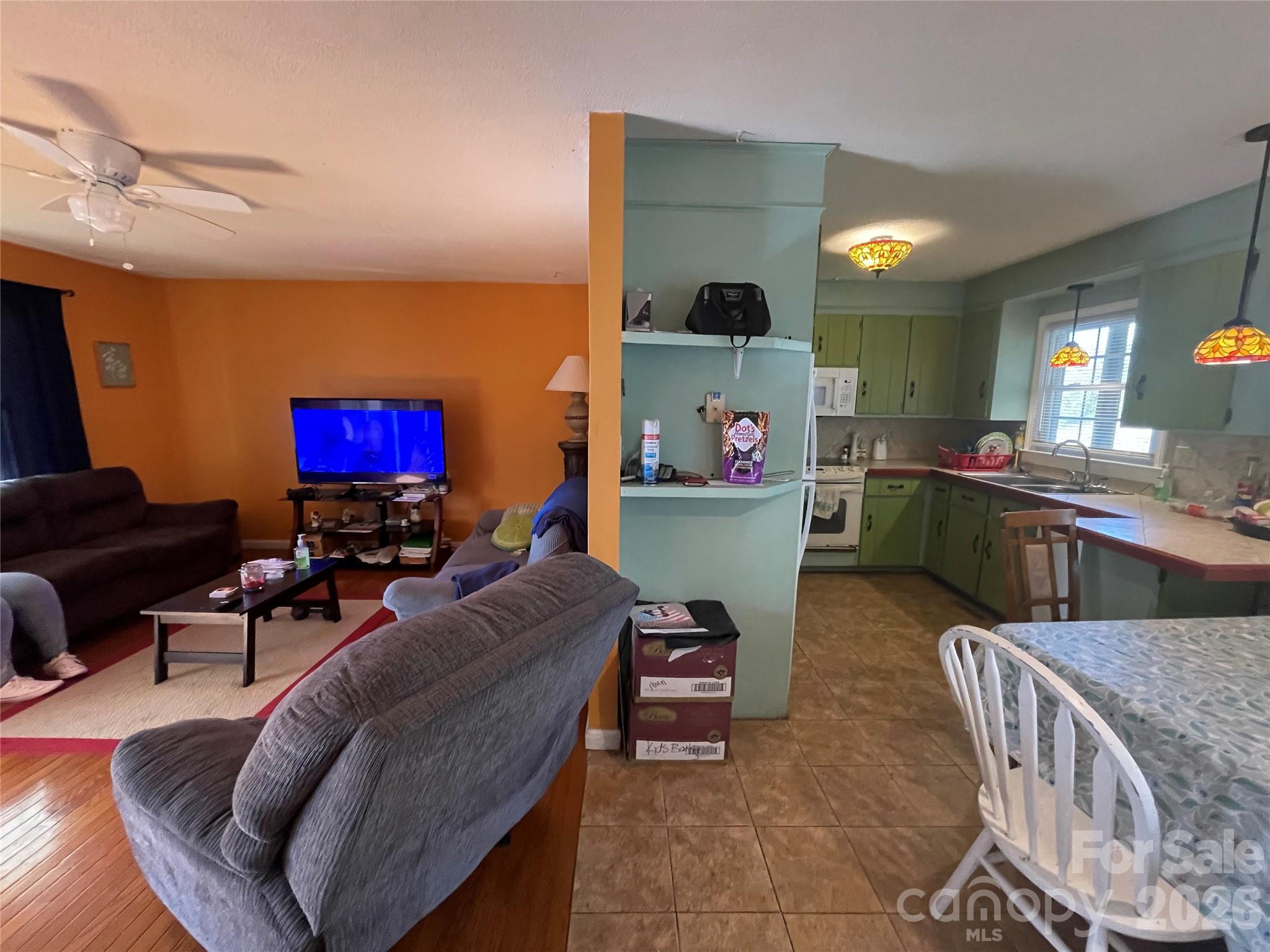 4907 Delmar Griffin Road Monroe, NC 28112 - Photo 5 of 25 a living room with furniture and a flat screen tv