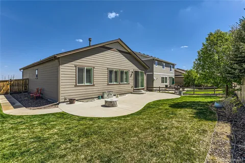 a view of backyard with sitting area
