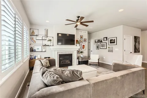 a living room with furniture and kitchen view