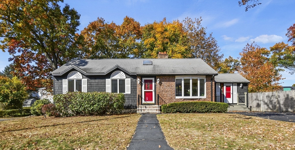 25 Anna Road Woburn, MA 01801 - Photo 1 of 39 a front view of a house with a yard