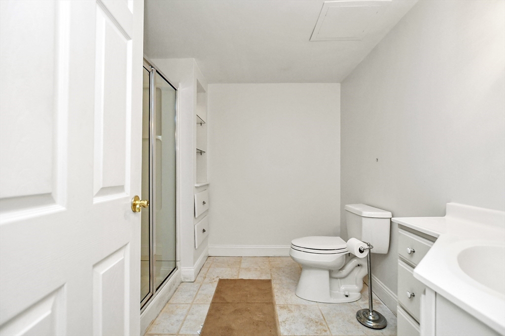 25 Anna Road Woburn, MA 01801 - Photo 27 of 39 a bathroom with a toilet and a shower