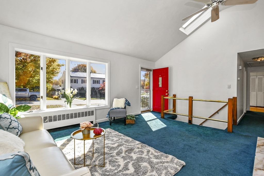 25 Anna Road Woburn, MA 01801 - Photo 3 of 39 a living room with furniture a rug and a wooden floor