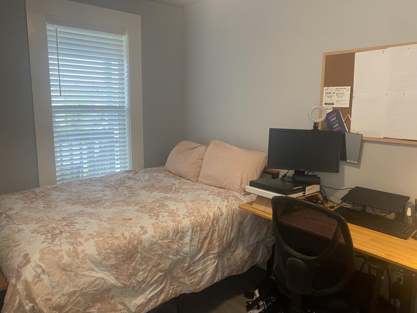 1132 85th Avenue Oakland, CA 94621 - Photo 15 of 28 a bedroom with a bed and a computer on the desk