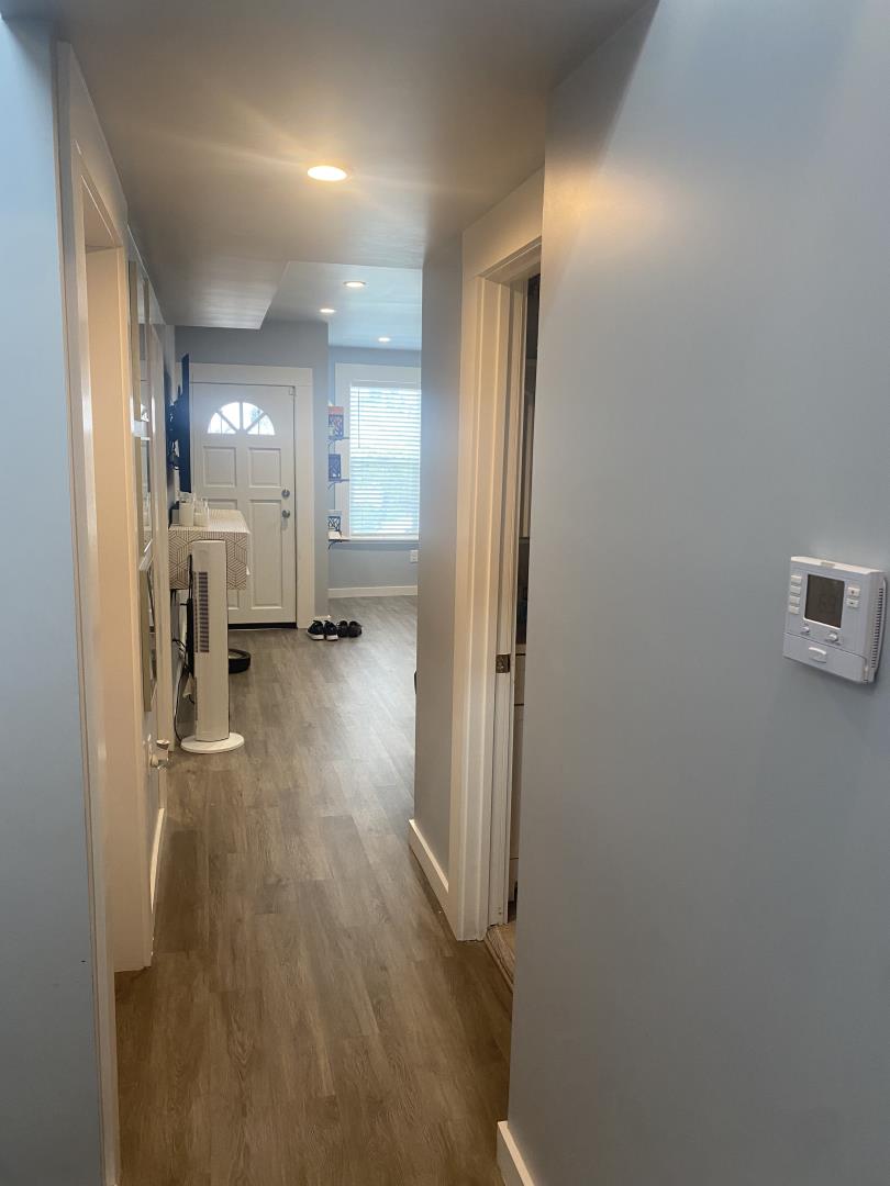 1132 85th Avenue Oakland, CA 94621 - Photo 16 of 28 a view of a hallway with wooden floor