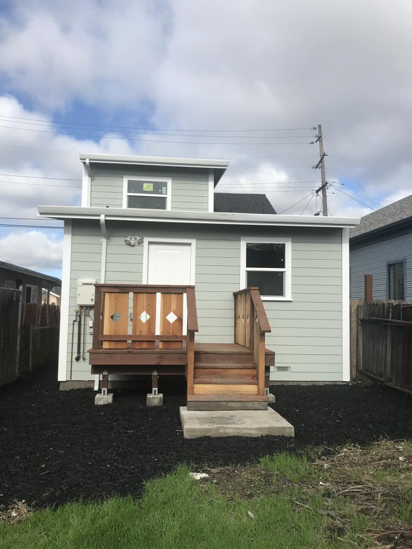 1132 85th Avenue Oakland, CA 94621 - Photo 28 of 28 a front view of a house with a yard