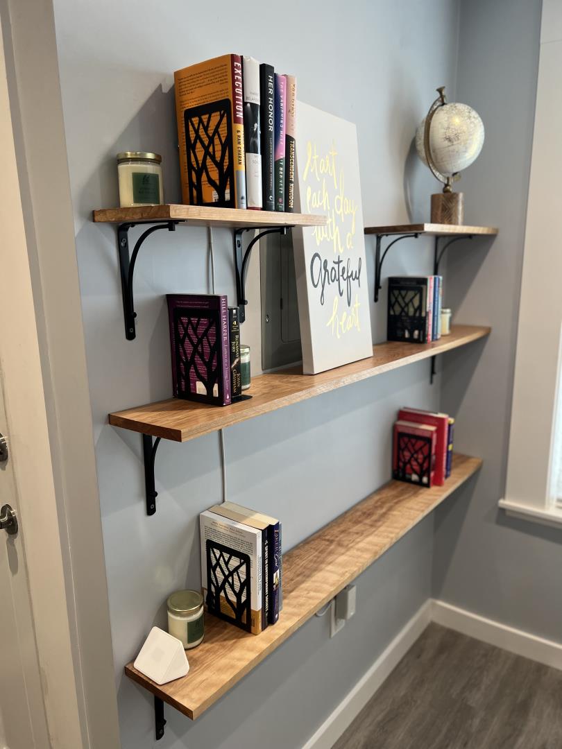 1132 85th Avenue Oakland, CA 94621 - Photo 7 of 28 a living room with shelf