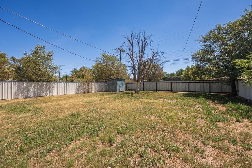 108 Spruce Avenue Dumas, TX 79029 - Photo 15 of 15 a view of backyard and tree
