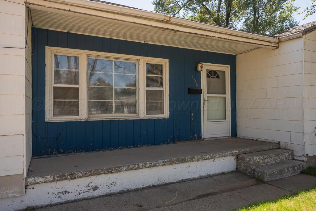 108 Spruce Avenue Dumas, TX 79029 - Photo 3 of 15 a front view of a house