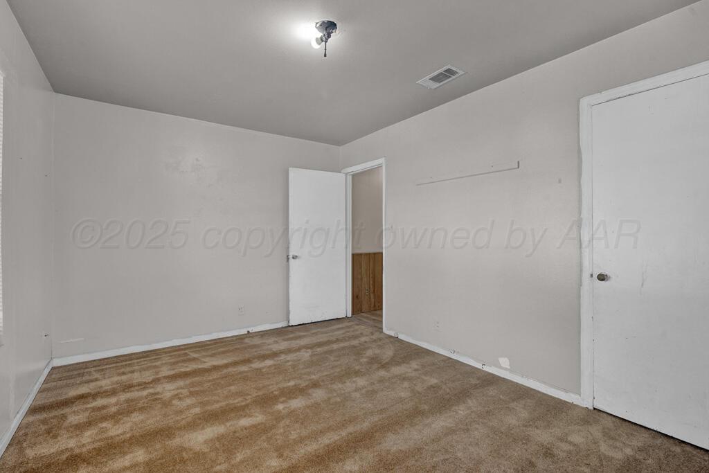 108 Spruce Avenue Dumas, TX 79029 - Photo 9 of 15 a view of an empty room