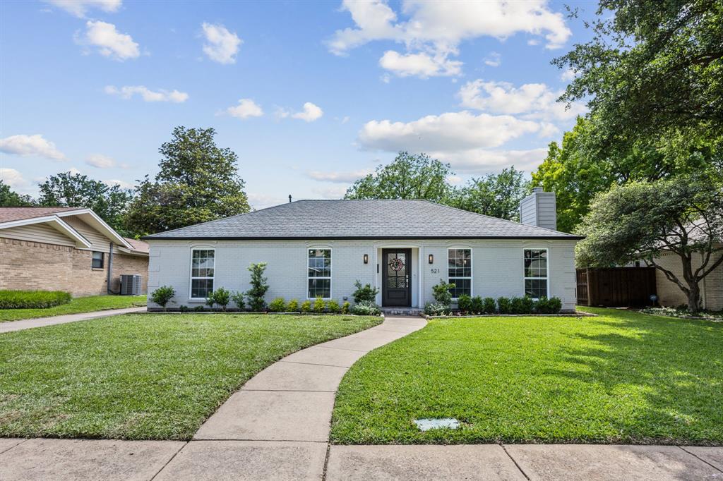 a view of a house with a yard