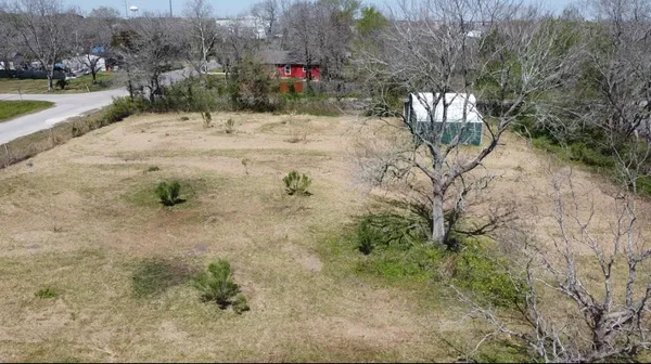 a view of a backyard of the house
