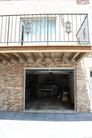 a living room with a table and a large window