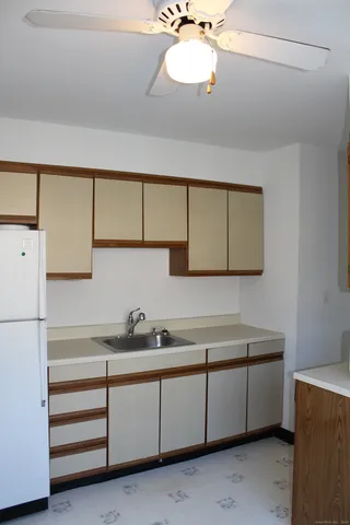 a kitchen with a cabinets and chandelier