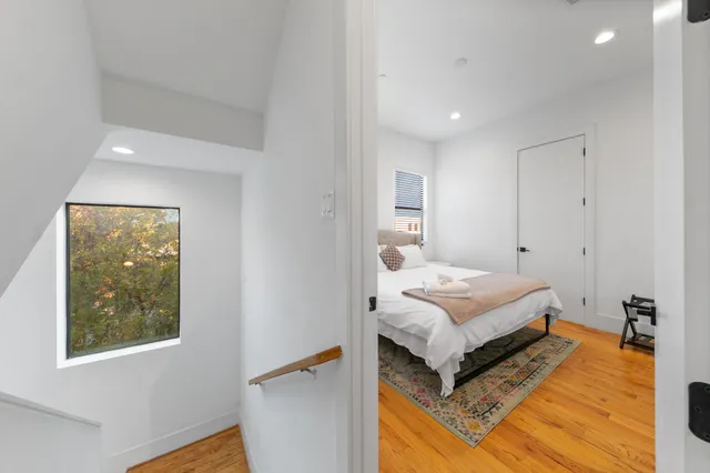 a view of kitchen with dining room and wooden floor