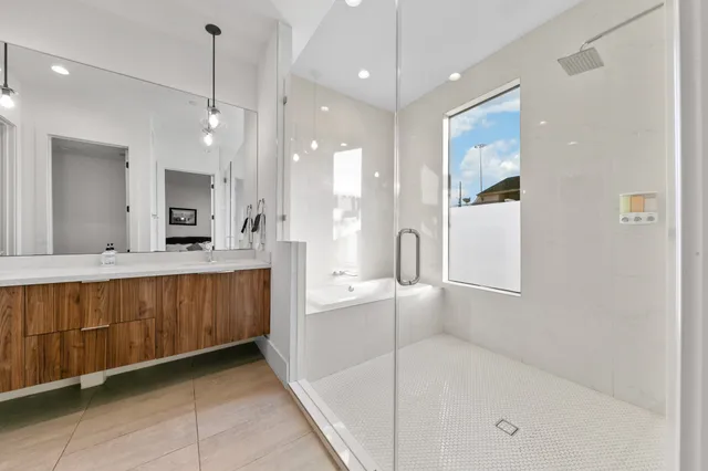 a bed room with a bed and a chair