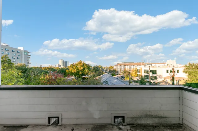 a bathroom with a double vanity sink toilet and shower