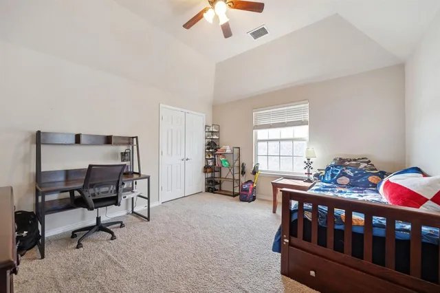 a bedroom with furniture and a window