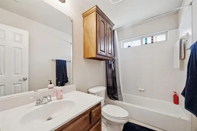 a bathroom with a sink a toilet and a bathtub