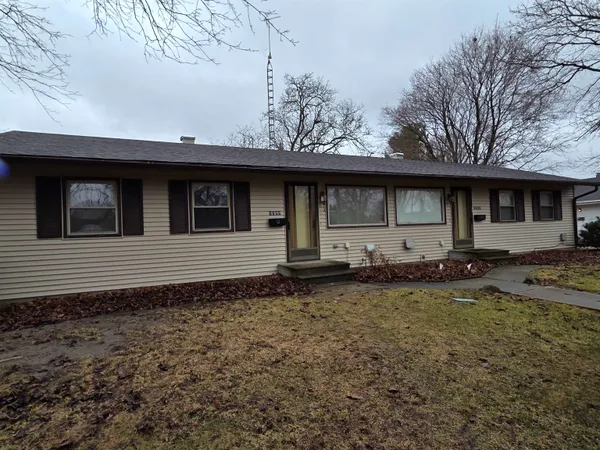 a house with trees in the background