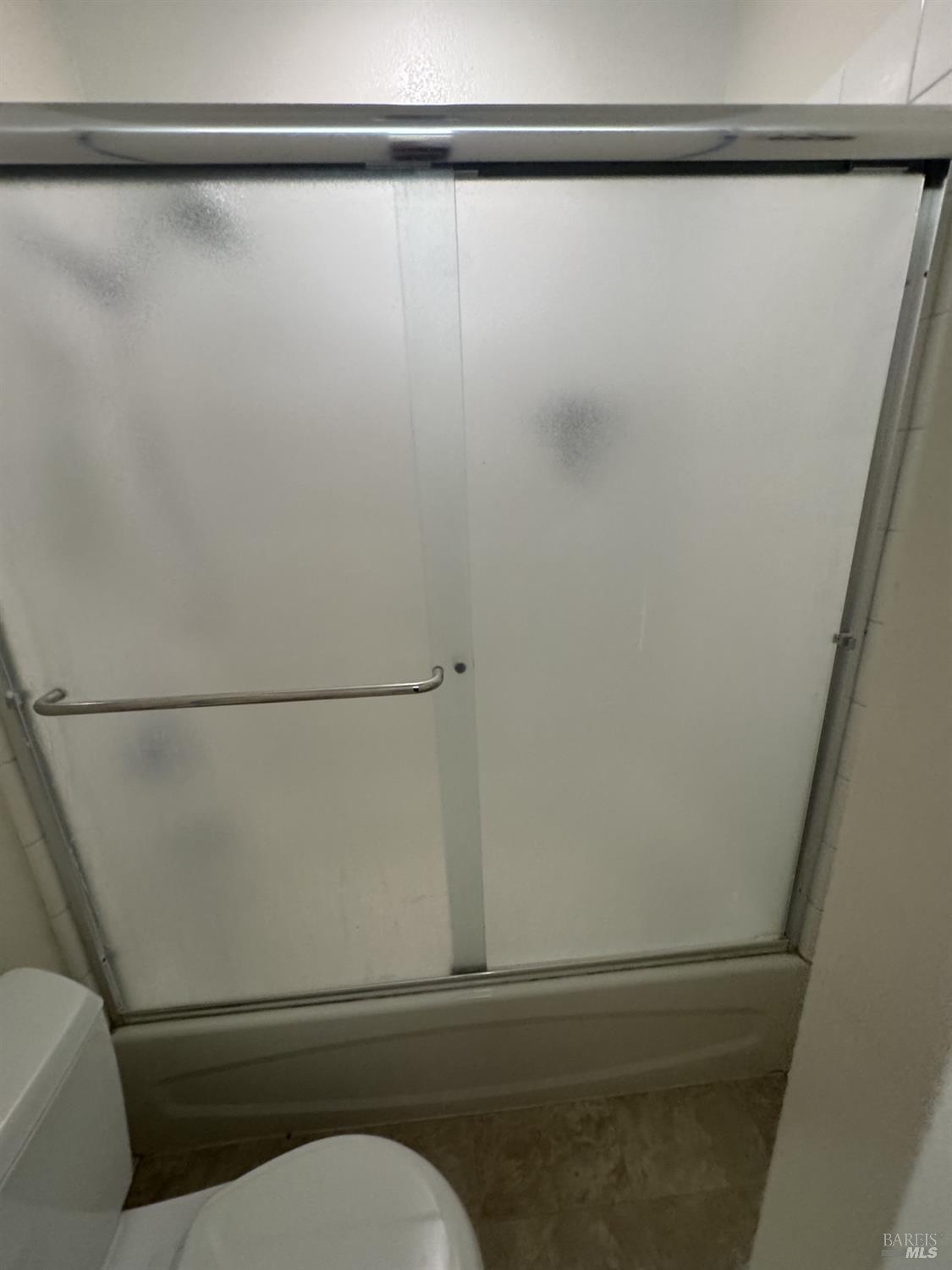 33 Lakeview Court Novato, CA 94947 - Photo 12 of 18 a bathroom with a shower and a toilet