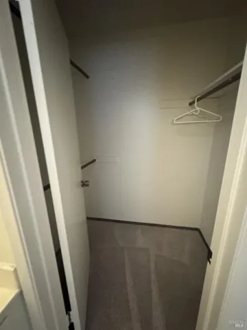 a view of a storage & utility room with a sink