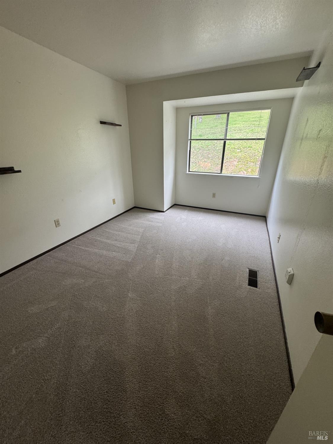 33 Lakeview Court Novato, CA 94947 - Photo 15 of 18 an empty room with windows