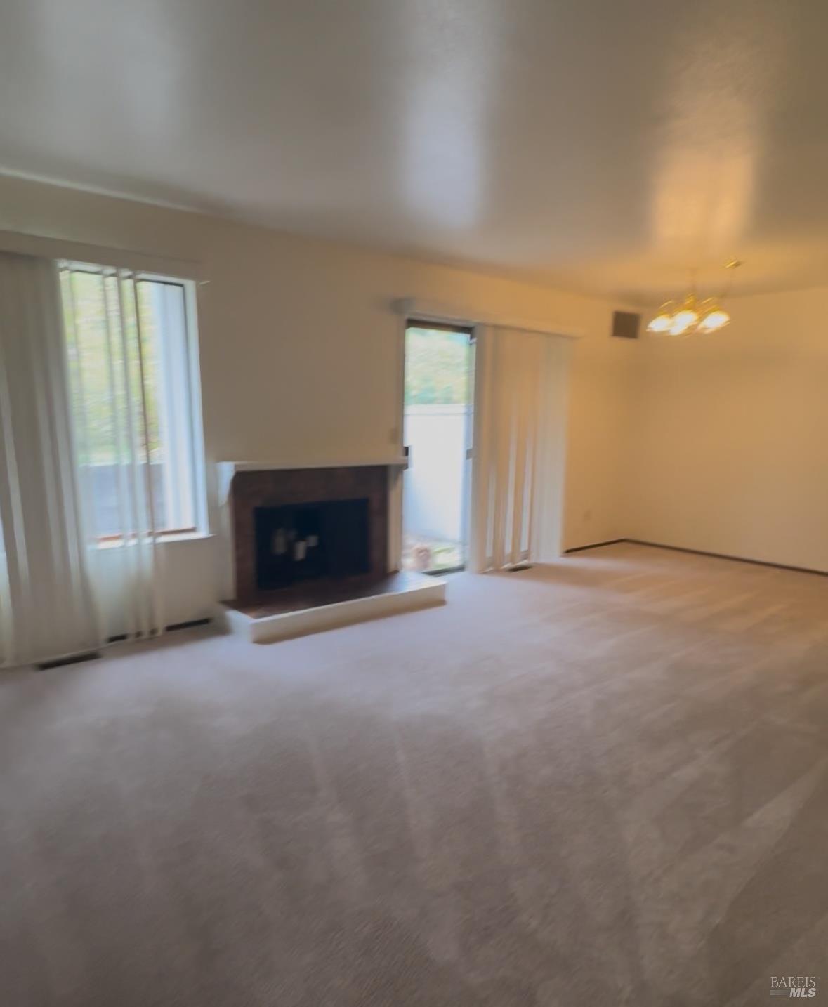 33 Lakeview Court Novato, CA 94947 - Photo 4 of 18 a view of empty room with fireplace