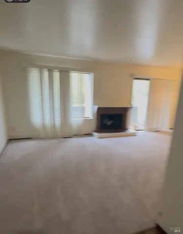 an empty room with a fireplace