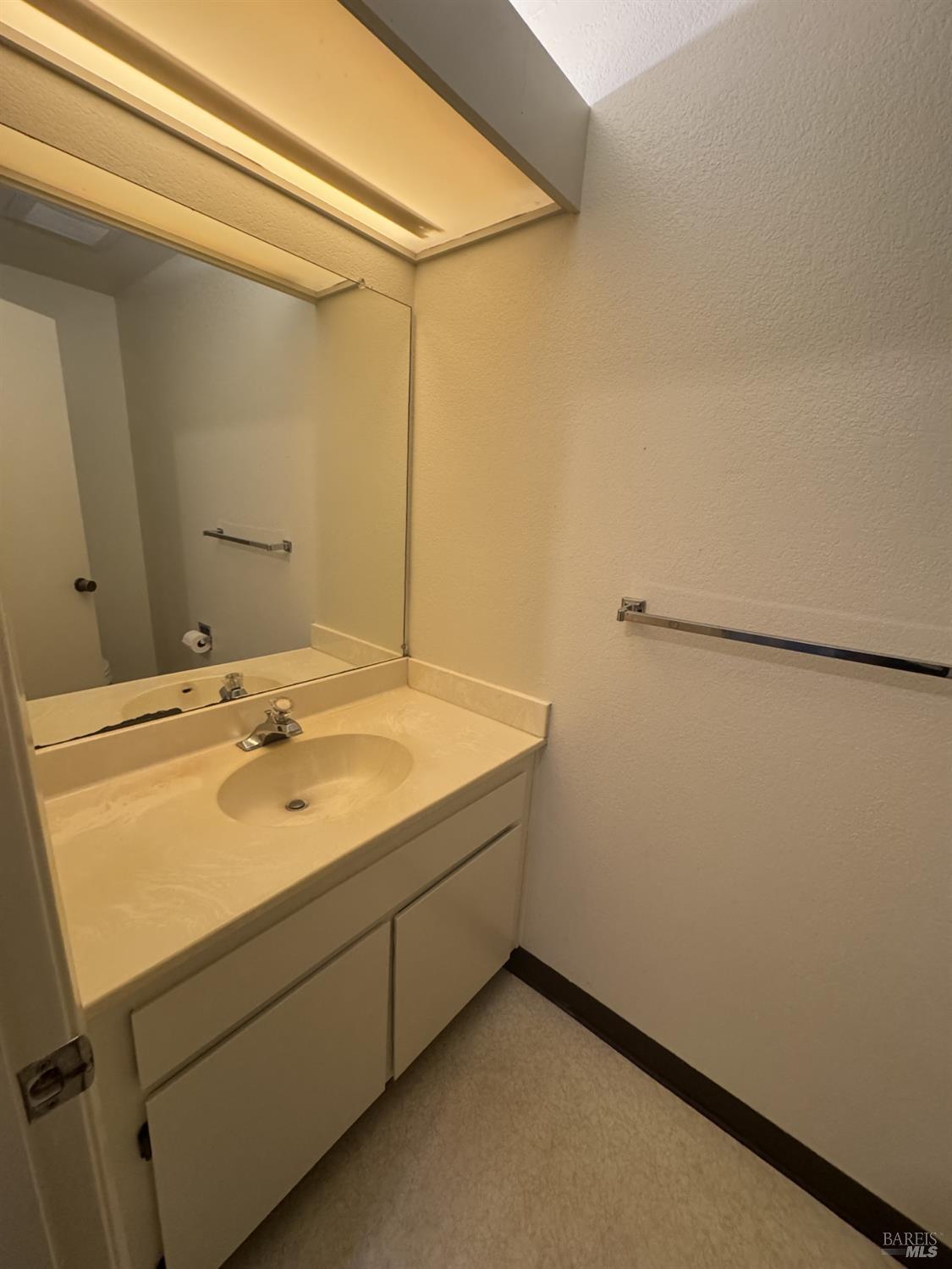 33 Lakeview Court Novato, CA 94947 - Photo 9 of 18 a bathroom with a sink and a mirror