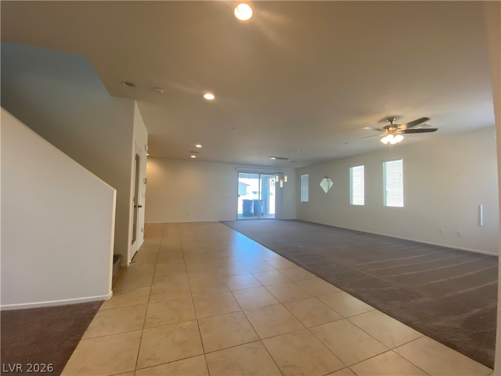 436 Cadence View Way Henderson, NV 89011 - Photo 36 of 36 An open floorplan features recessed lighting and a sliding glass door leading to the outdoors.