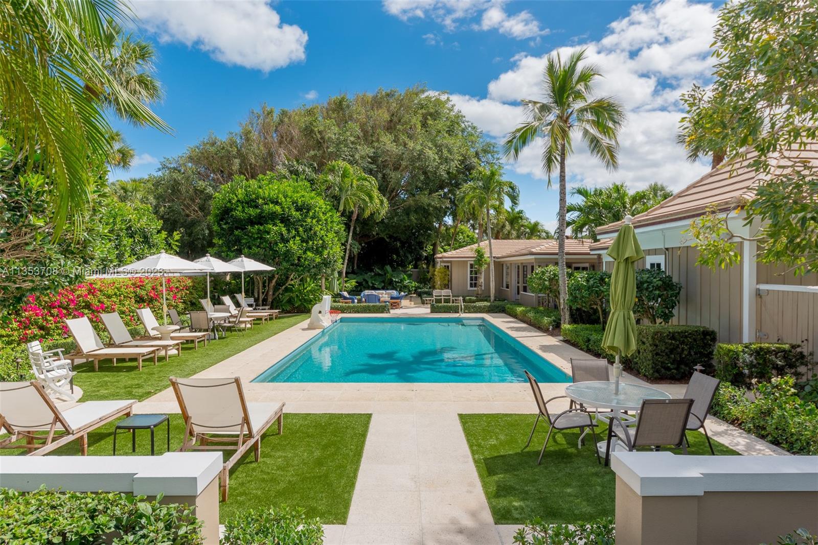 115 Gomez Road Jupiter Island, FL 33455 - Photo 1 of 20 a view of backyard with swimming pool and seating space