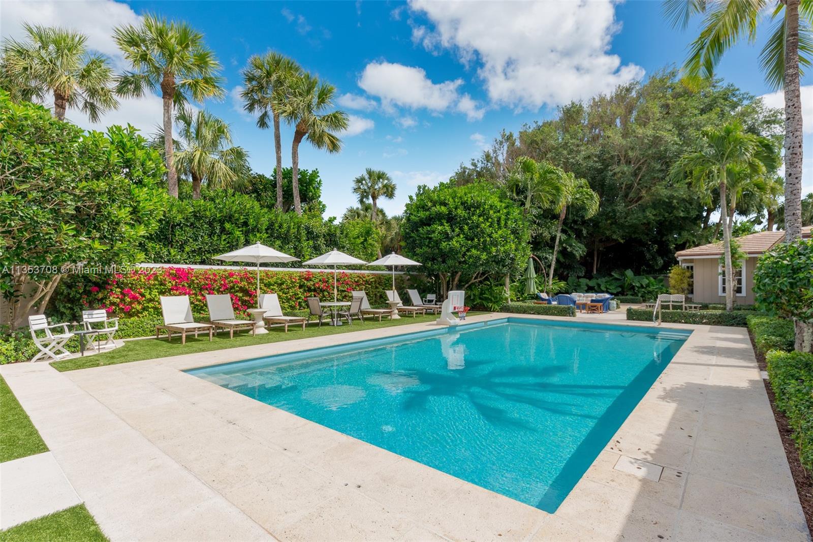 115 Gomez Road Jupiter Island, FL 33455 - Photo 14 of 20 a view of swimming pool with a garden