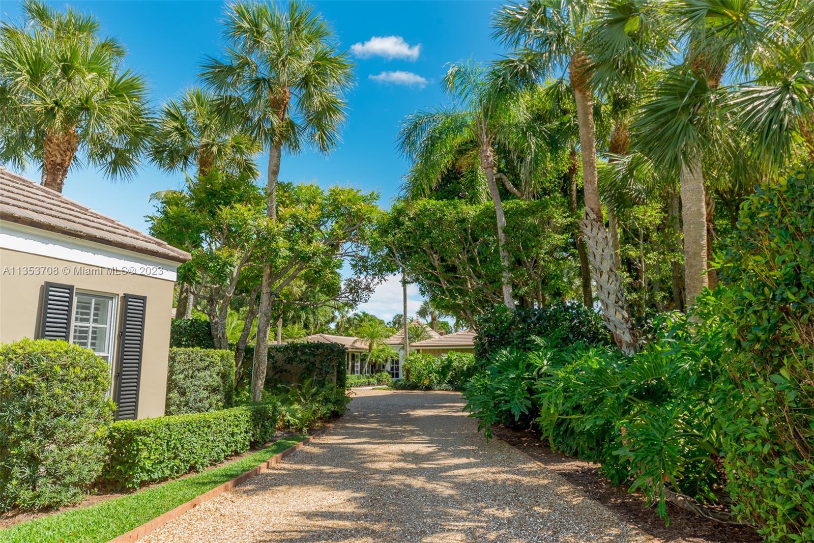 115 Gomez Road Jupiter Island, FL 33455 - Photo 15 of 20 a view of a street with plants and trees