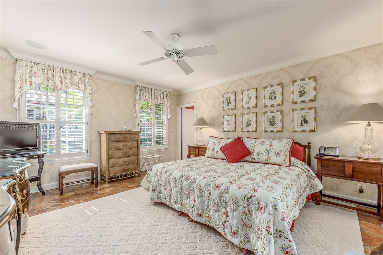 115 Gomez Road Jupiter Island, FL 33455 - Photo 8 of 20 a bedroom with a bed dresser and a flat screen tv