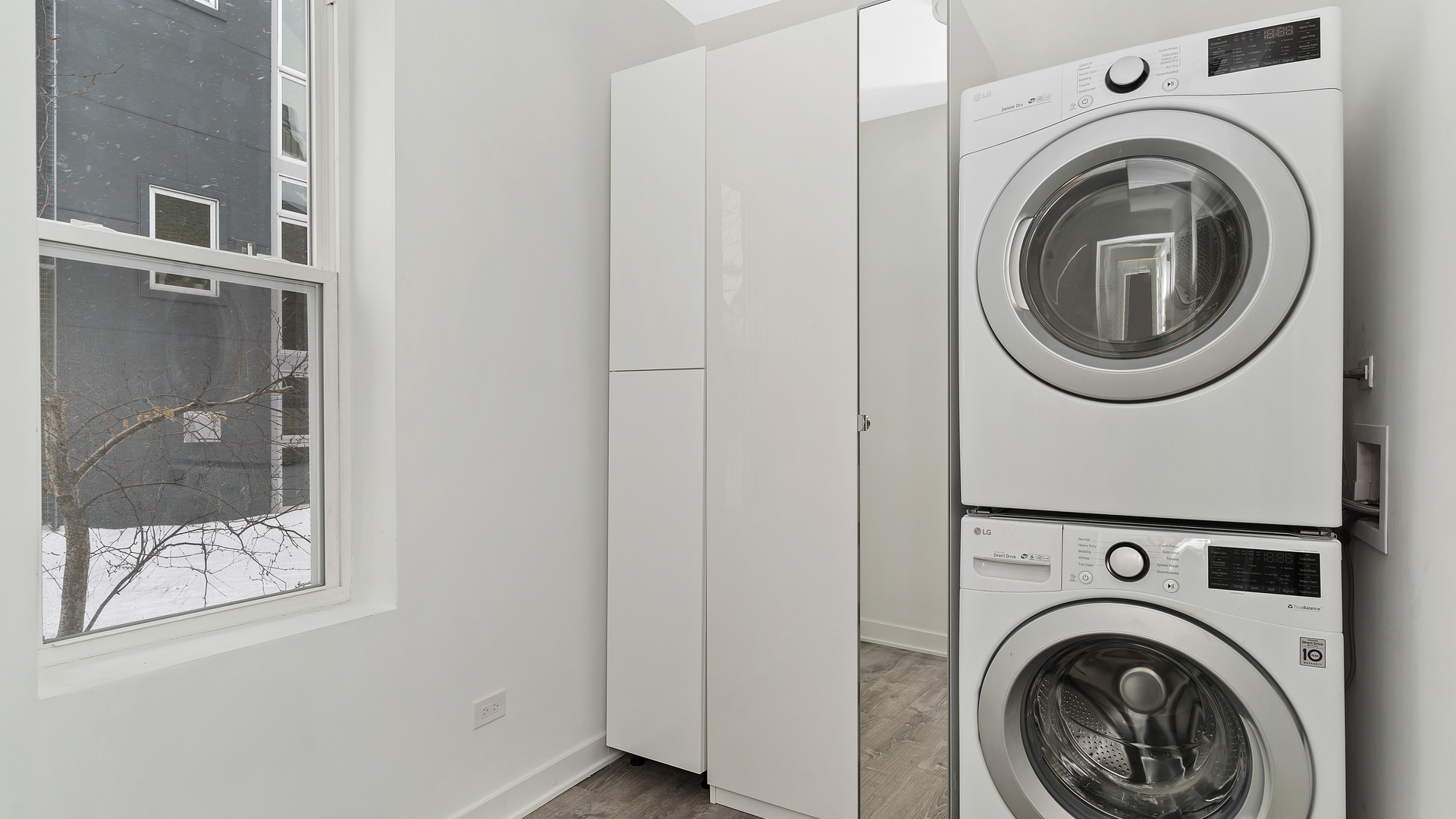 Undisclosed Address Chicago, IL 60622 - Photo 5 of 14 a view of a hallway with washer and dryer