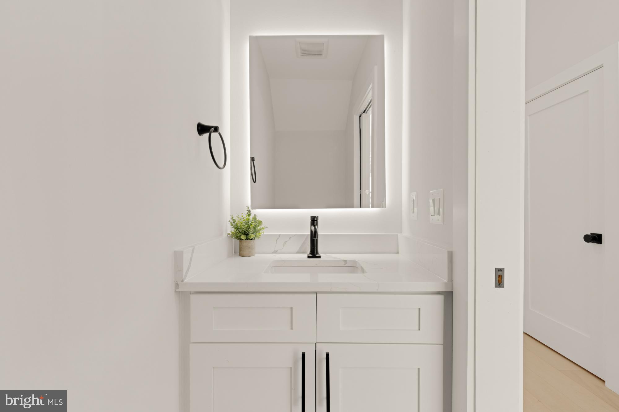 5505 7th Street Northwest, Unit 5 Washington, DC 20011 - Photo 11 of 27 a bathroom with a sink and a mirror