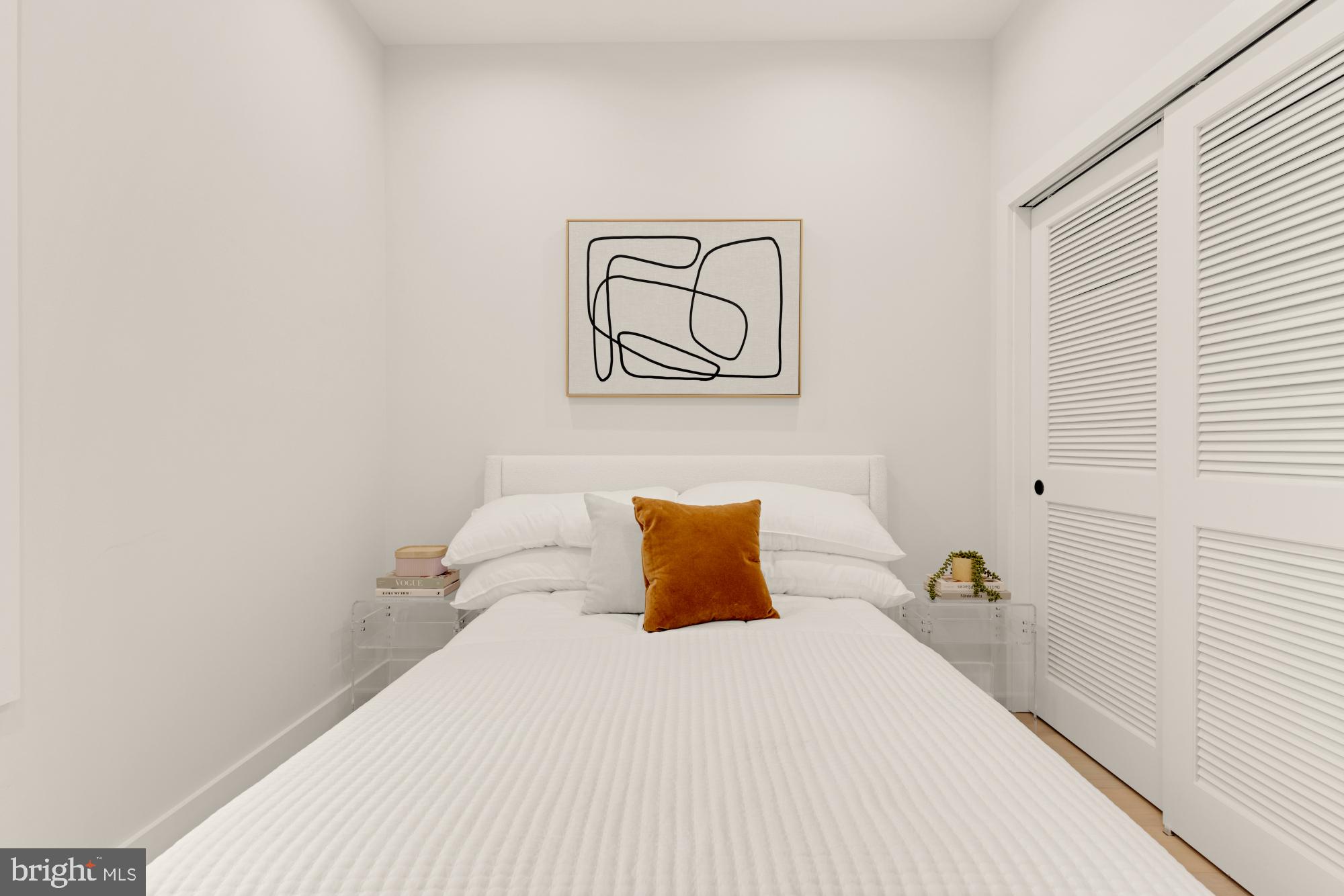 5505 7th Street Northwest, Unit 5 Washington, DC 20011 - Photo 13 of 27 a bedroom with a bed and wall painting