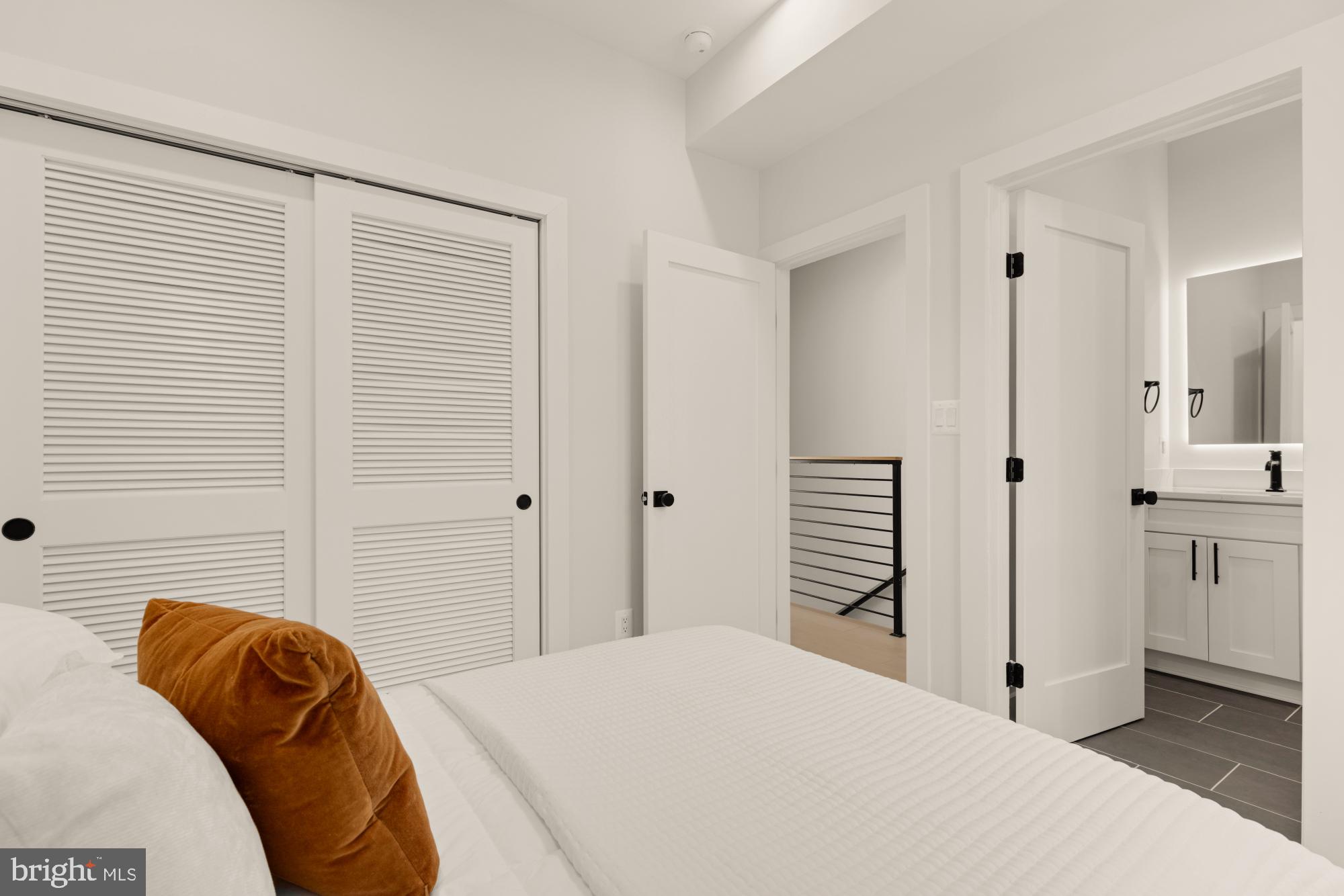 5505 7th Street Northwest, Unit 5 Washington, DC 20011 - Photo 14 of 27 a bedroom with a bed and a closet