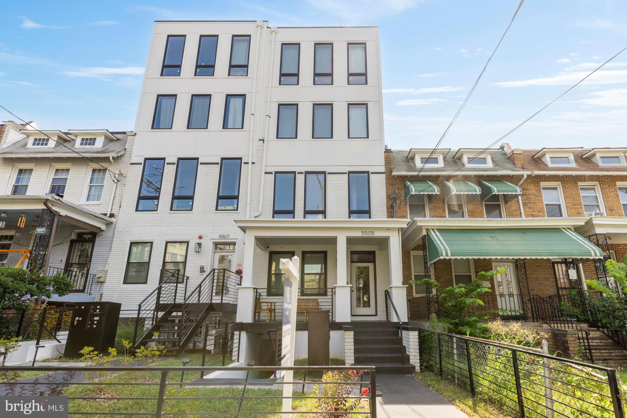 5505 7th Street Northwest, Unit 5 Washington, DC 20011 - Photo 27 of 27 a front view of a residential apartment building with a yard