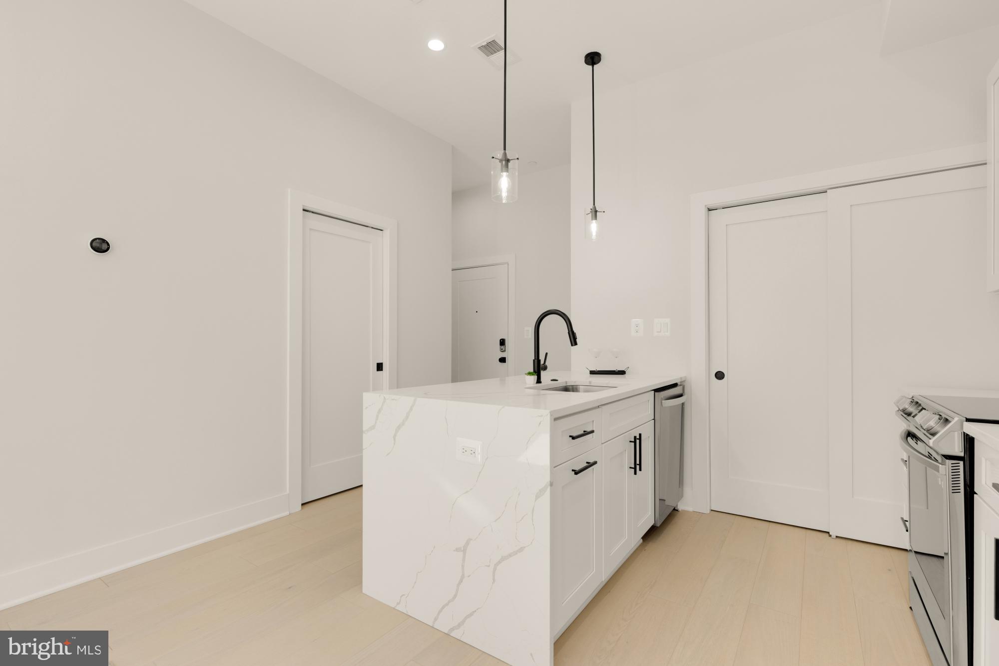 5505 7th Street Northwest, Unit 5 Washington, DC 20011 - Photo 8 of 27 a view of a sink and chandelier