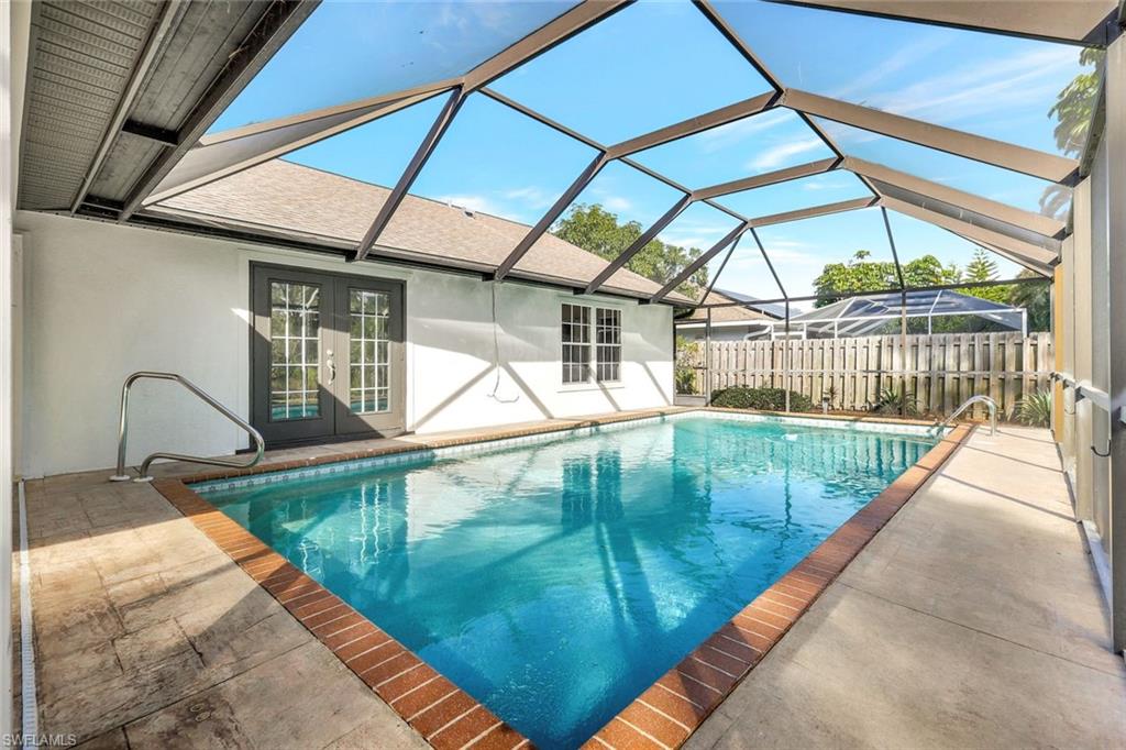 3650 Kent Drive Naples, FL 34112 - Photo 24 of 40 a view of a swimming pool
