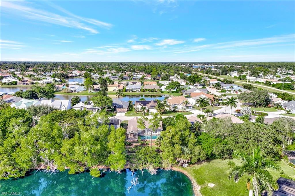 3650 Kent Drive Naples, FL 34112 - Photo 37 of 40 an aerial view of residential houses with outdoor space and trees