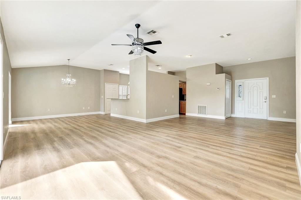 3650 Kent Drive Naples, FL 34112 - Photo 6 of 40 a view of empty room with wooden floor and fan