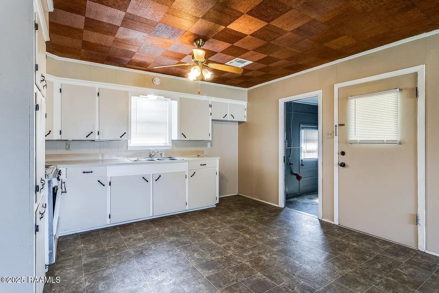 907 Elizabeth Street Scott, LA 70583 - Photo 7 of 14 907 Elizabeth - kitchen facing laundry