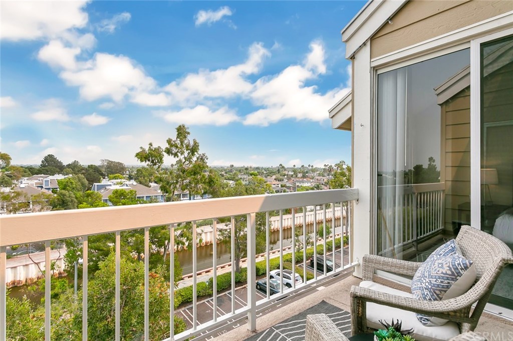 20331 Bluffside Circle, Unit A416 Huntington Beach, CA 92646 - Photo 15 of 42 a view of a chair and tables in the balcony