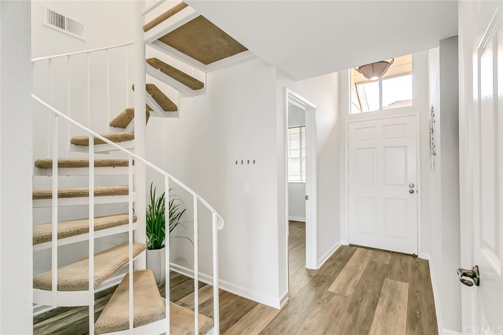 20331 Bluffside Circle, Unit A416 Huntington Beach, CA 92646 - Photo 25 of 42 a view of entryway and hall with wooden floor